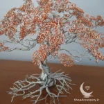 درخت سیمی با برگ های مسی